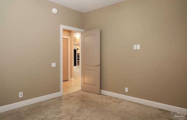 4436 Soundside Dr, Gulf Breeze, FL 32563 - unfurnished room with light carpet, baseboards, and a smoke detector
