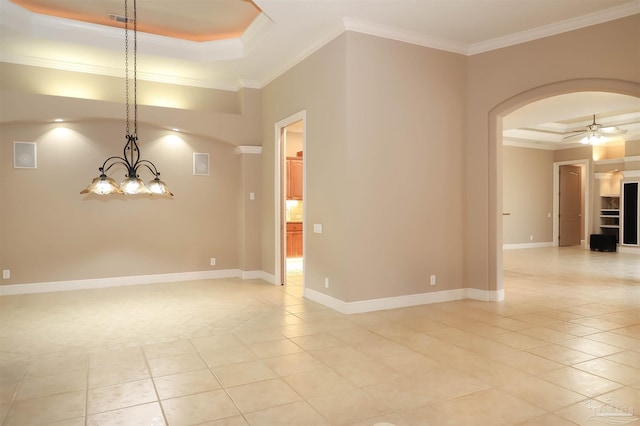 4436 Soundside Dr, Gulf Breeze, FL 32563 - empty room with light tile patterned floors, crown molding, a raised ceiling, arched walkways, and ceiling fan