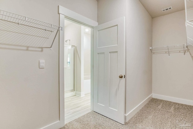 4680 Eider Rd, Pace, FL 32571 - walk in closet featuring light carpet