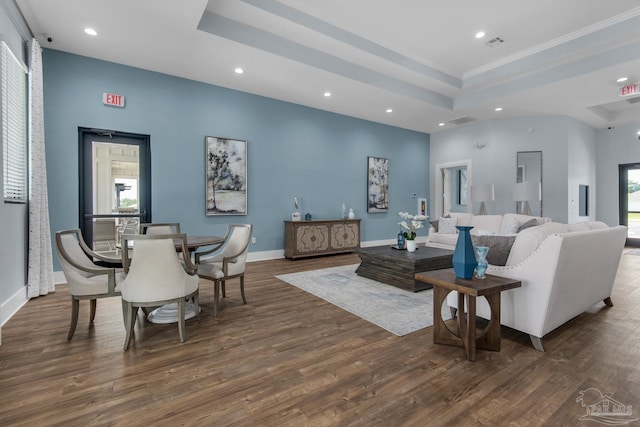 4680 Eider Rd, Pace, FL 32571 - living area featuring recessed lighting, dark wood-style flooring, a tray ceiling, and ornamental molding