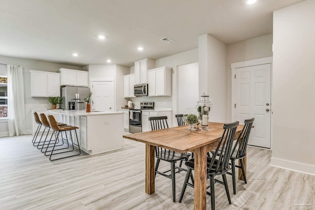 4680 Eider Rd, Pace, FL 32571 - dining area featuring light wood-style flooring and recessed lighting