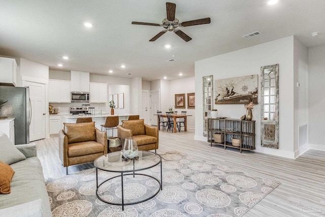 4680 Eider Rd, Pace, FL 32571 - living room with light wood finished floors, ceiling fan, and recessed lighting