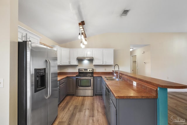 kitchen featuring stainless steel appliances, sink, white cabinetry, and gray cabinets