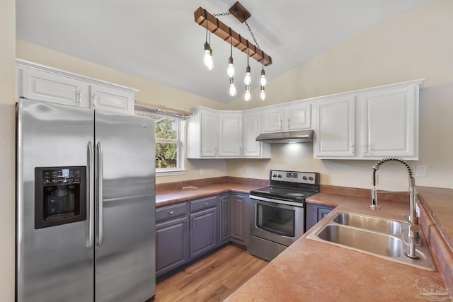 kitchen featuring appliances with stainless steel finishes, light hardwood / wood-style flooring, white cabinets, and sink