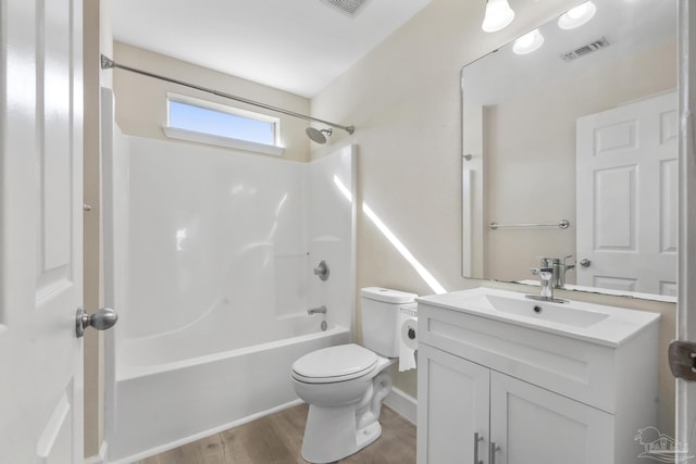 full bathroom with toilet, vanity, shower / tub combination, and hardwood / wood-style floors