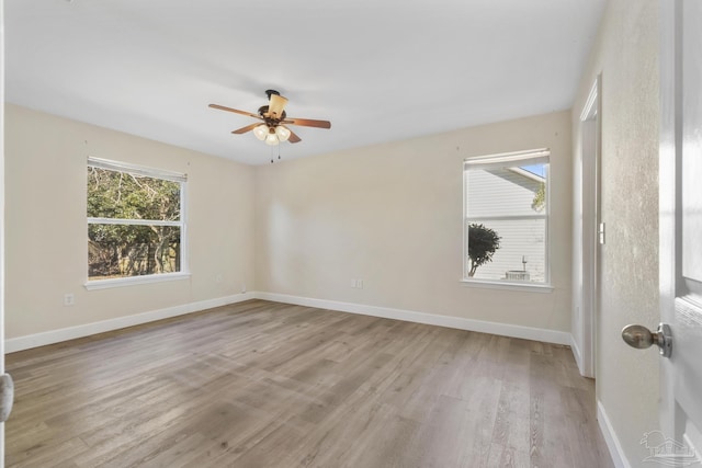 empty room with light wood-type flooring and ceiling fan