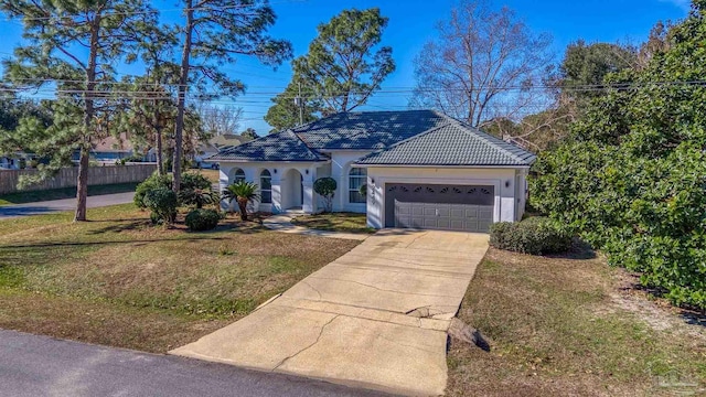 view of front of house with a front yard and a garage