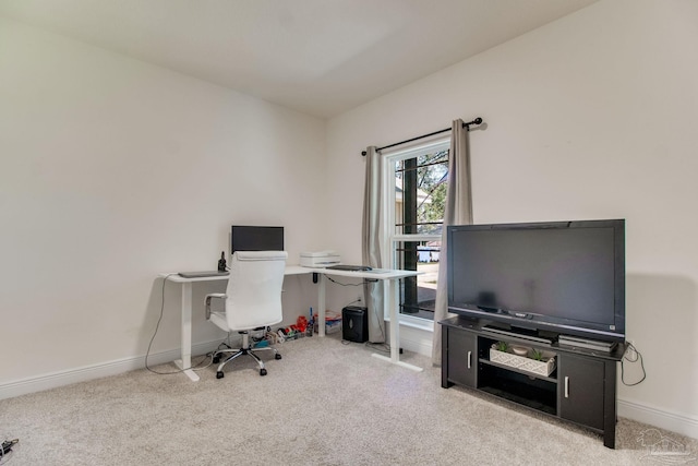 carpeted office space with baseboards