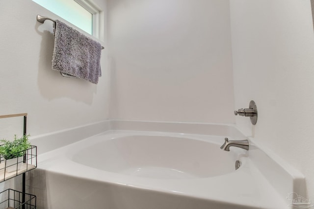 bathroom featuring a garden tub