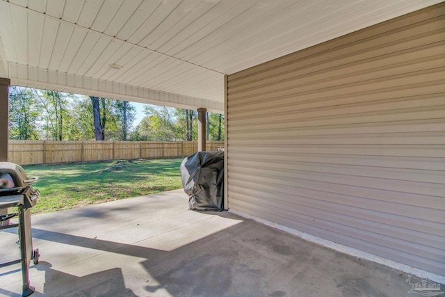 view of patio featuring grilling area and fence