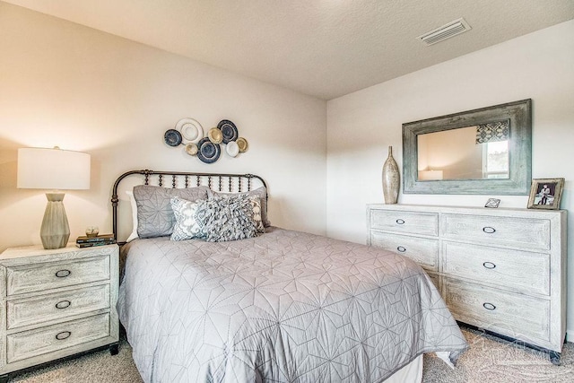 bedroom featuring visible vents and carpet flooring