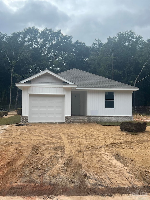 single story home featuring a garage