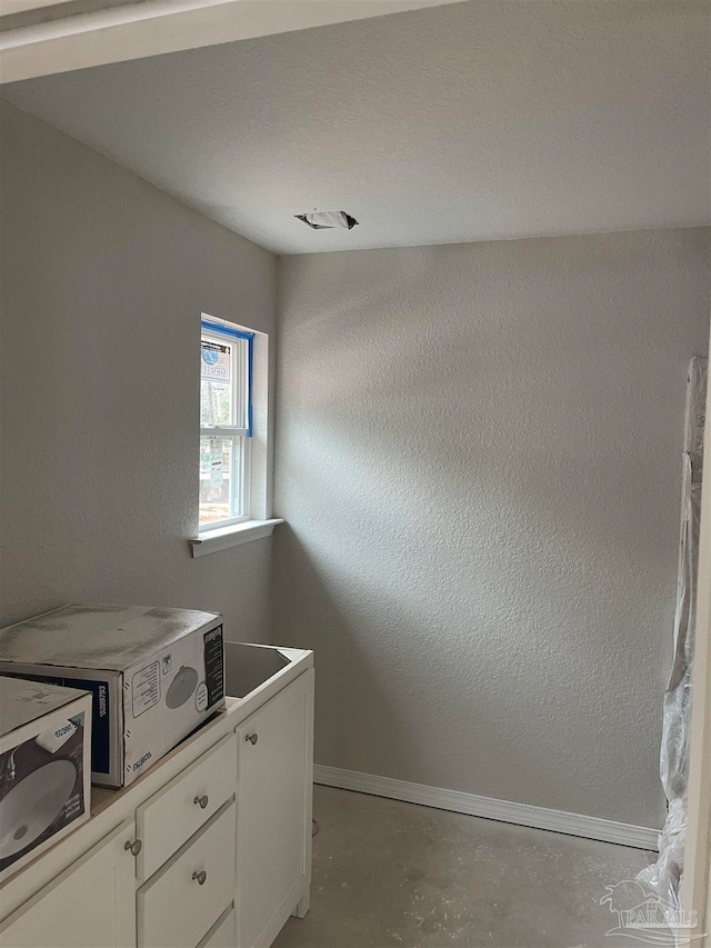 interior space featuring concrete flooring