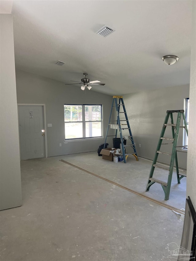 unfurnished living room featuring lofted ceiling and ceiling fan