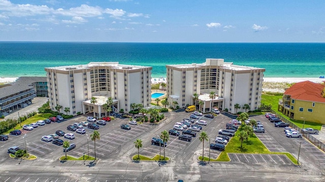 bird's eye view with a water view and a view of the beach