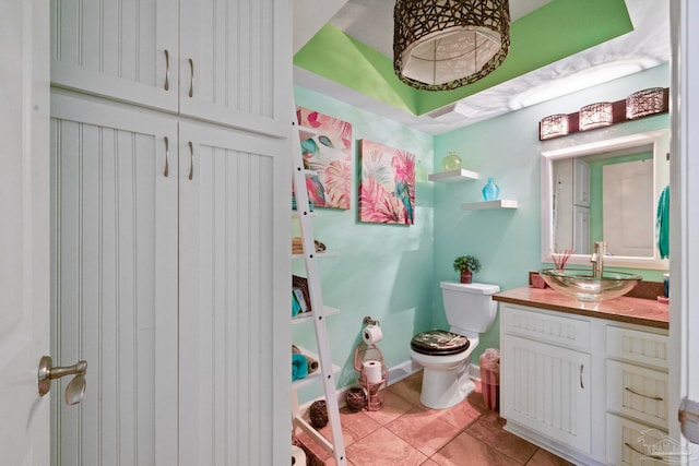 bathroom with tile patterned floors, toilet, and vanity