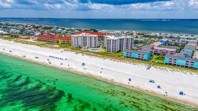 birds eye view of property featuring a view of the beach and a water view