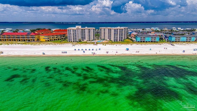 aerial view with a water view and a view of the beach