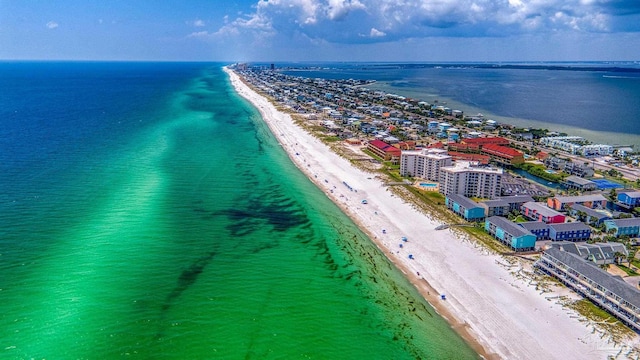 drone / aerial view with a beach view and a water view