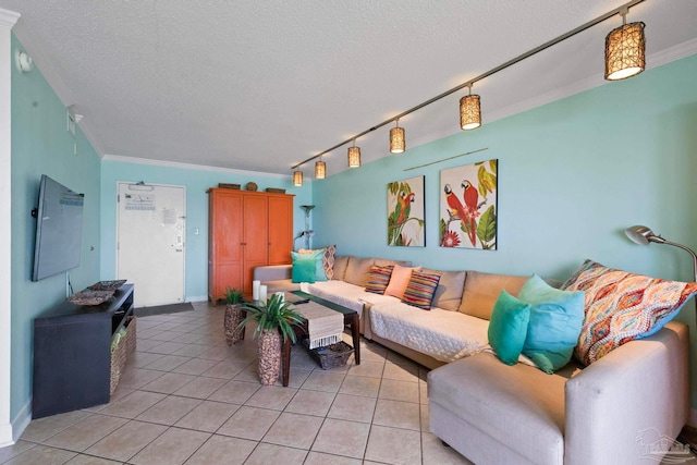 living room with rail lighting, a textured ceiling, crown molding, and light tile patterned flooring