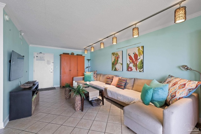 living room with rail lighting, a textured ceiling, crown molding, and light tile patterned flooring