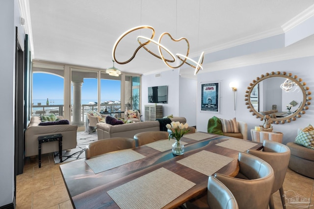 5 Portofino Dr Unit 703, Pensacola Beach, FL 32561 - dining room with ornamental molding, a chandelier, and a wall of windows
