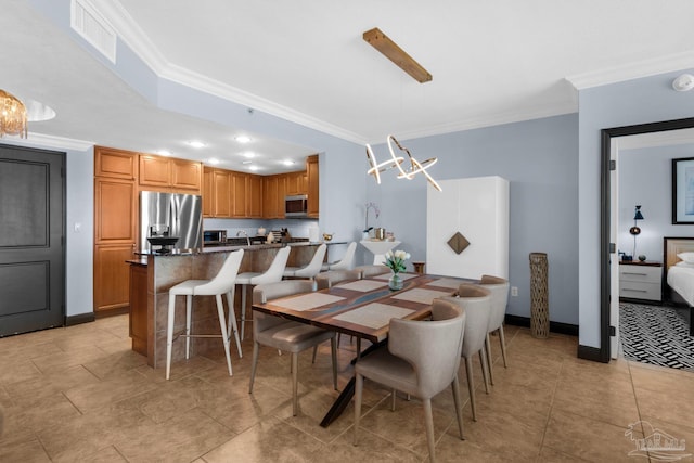 5 Portofino Dr Unit 703, Pensacola Beach, FL 32561 - dining room featuring ornamental molding and light tile patterned floors