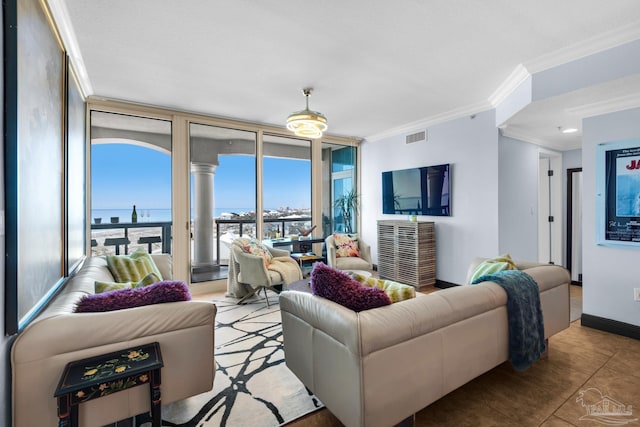 5 Portofino Dr Unit 703, Pensacola Beach, FL 32561 - tiled living room with crown molding and floor to ceiling windows
