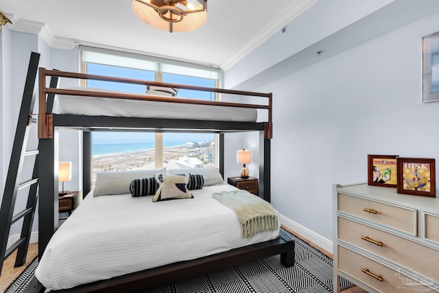 5 Portofino Dr Unit 703, Pensacola Beach, FL 32561 - bedroom with ornamental molding and multiple windows