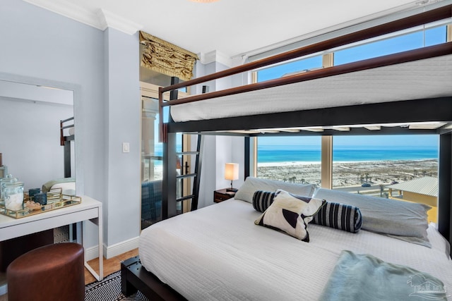 5 Portofino Dr Unit 703, Pensacola Beach, FL 32561 - bedroom featuring crown molding, a water view, and multiple windows
