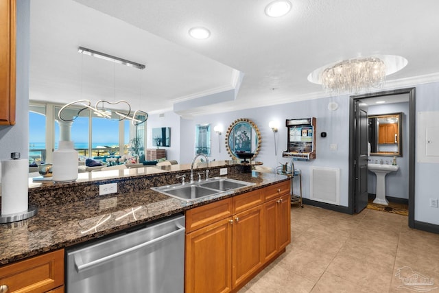5 Portofino Dr Unit 703, Pensacola Beach, FL 32561 - kitchen featuring dishwasher, brown cabinetry, a chandelier, dark stone counters, and ornamental molding