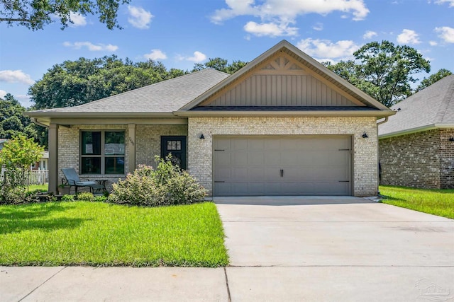 view of front facade featuring a front yard and a garage