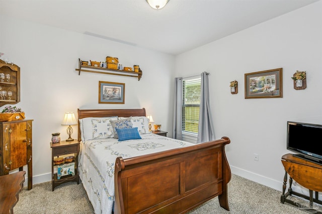 bedroom with light colored carpet