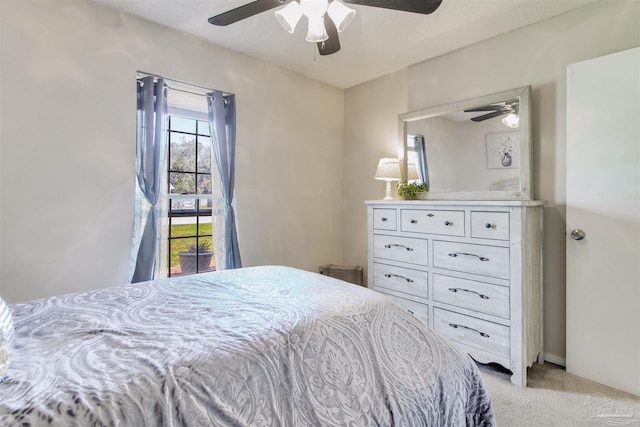 bedroom with light colored carpet and ceiling fan