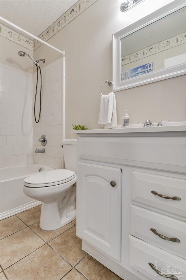 full bathroom featuring toilet, a textured ceiling, tile patterned flooring, bathtub / shower combination, and vanity