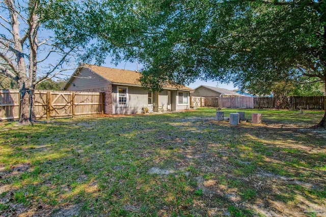 view of yard featuring a fenced backyard