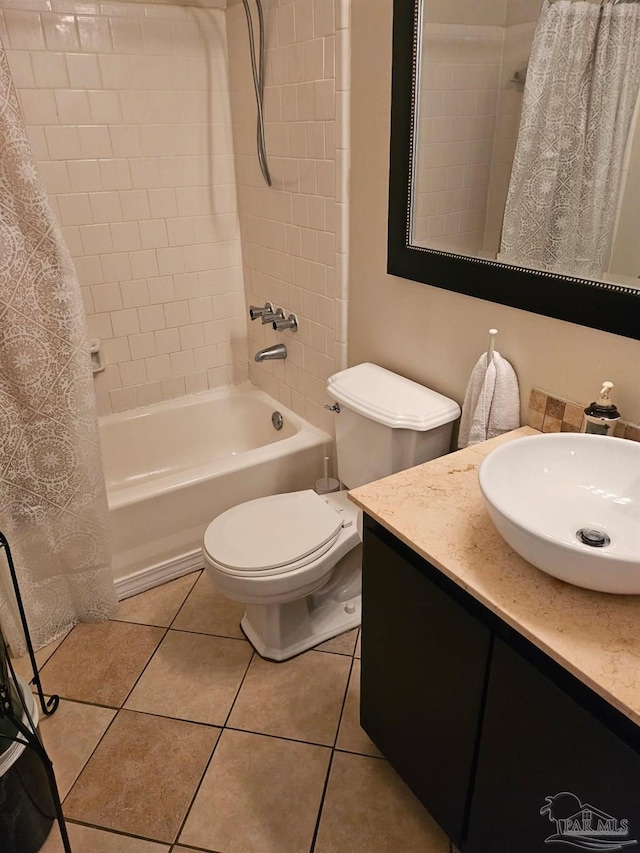 4701 Kitty Hawk Cir, Gulf Breeze, FL 32563 - bathroom with shower / bathtub combination with curtain, toilet, tile patterned floors, and vanity