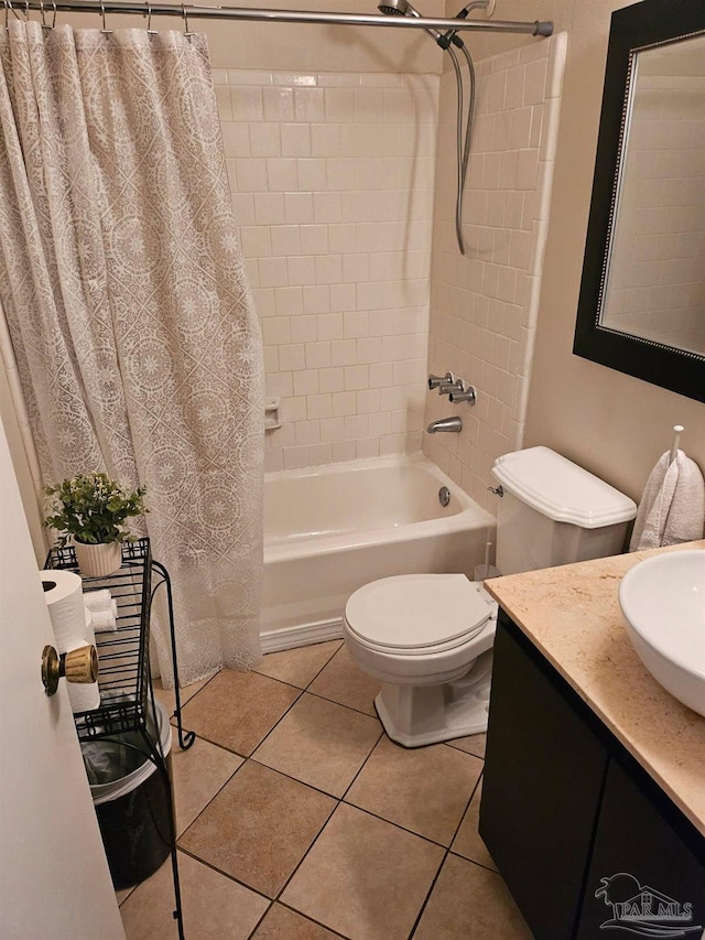 4701 Kitty Hawk Cir, Gulf Breeze, FL 32563 - full bath with shower / bath combo with shower curtain, toilet, tile patterned floors, and vanity