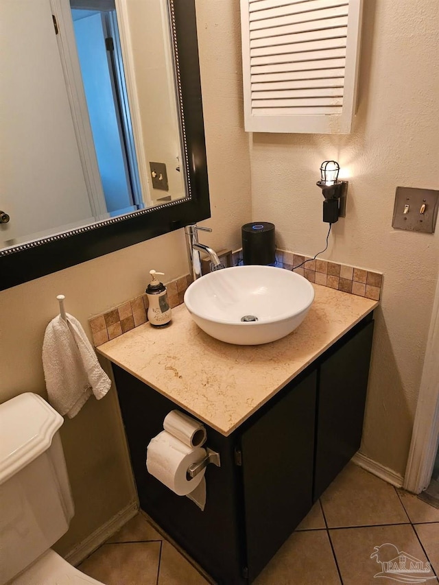 4701 Kitty Hawk Cir, Gulf Breeze, FL 32563 - bathroom with tile patterned flooring, vanity, toilet, and baseboards