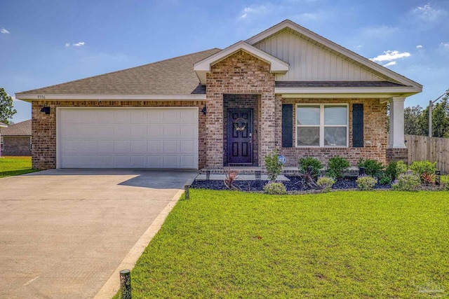 view of front of home featuring a garage and a front lawn