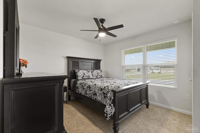 bedroom with light carpet and ceiling fan