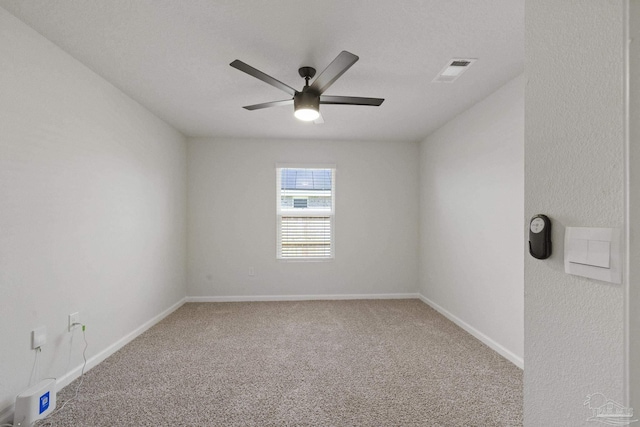 unfurnished room with ceiling fan and carpet floors