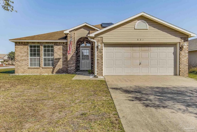 ranch-style house with a garage and a front lawn