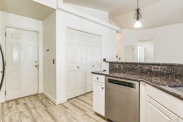 kitchen featuring decorative light fixtures, dishwasher, dark stone countertops, and white cabinetry