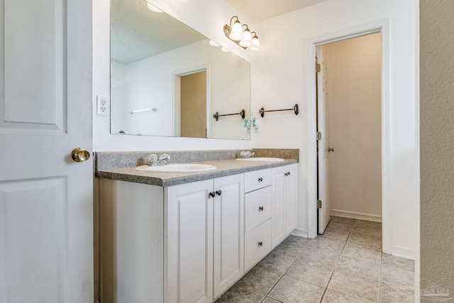 bathroom featuring vanity and tile patterned flooring