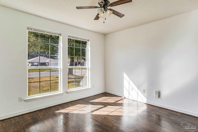 spare room featuring a textured ceiling, ceiling fan, and hardwood / wood-style flooring