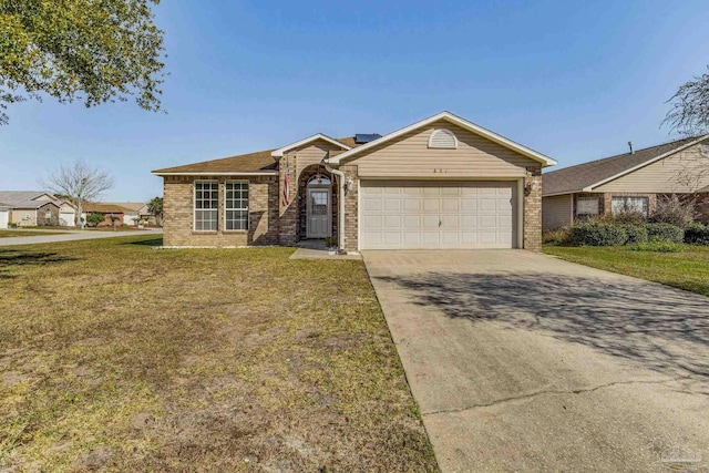 ranch-style house featuring a garage and a front yard