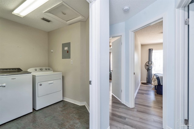 washroom featuring laundry area, attic access, a textured ceiling, and independent washer and dryer