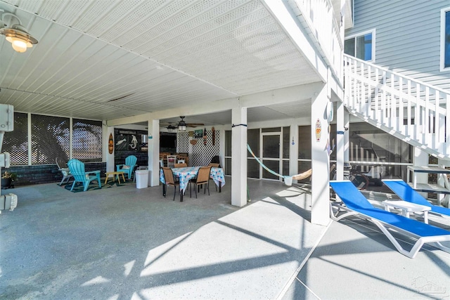 view of patio / terrace with outdoor dining space and stairway