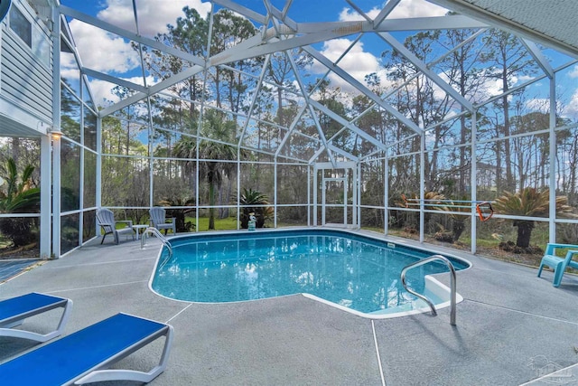 outdoor pool featuring a lanai and a patio area